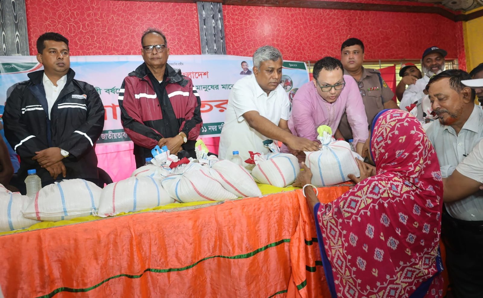 State Minister Anindya Islam Amit distributing relief to flood-affected people in Chattogram, 12 July 2026