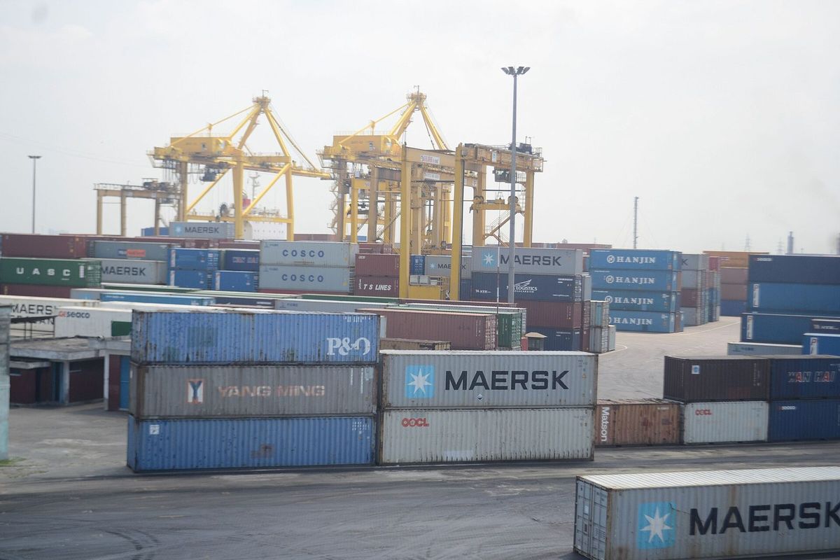 Stacked containers and ship-to-shore cranes at the Port of Chattogram