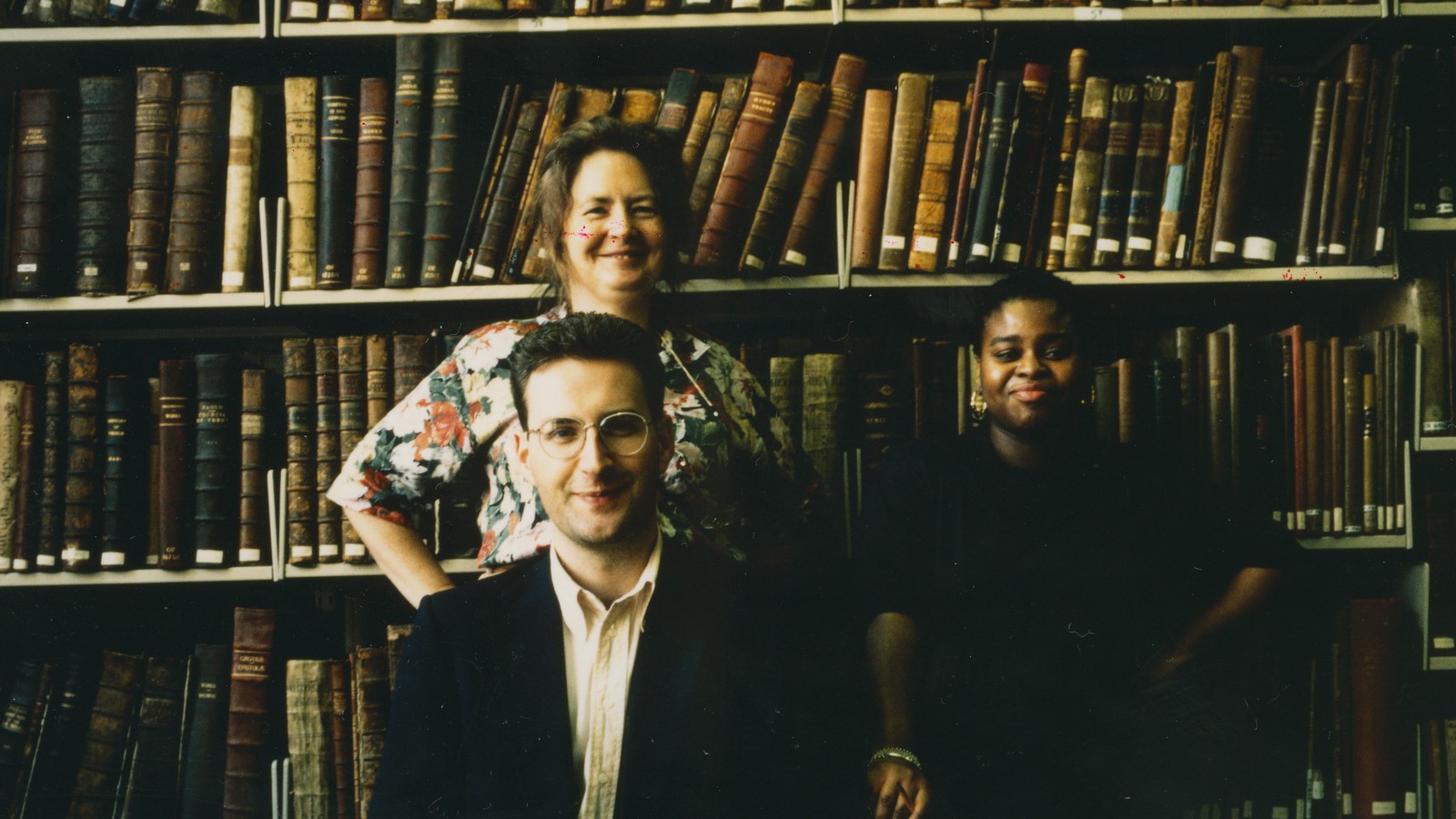 Archives staff working among shelves of bound volumes and archival boxes, LSE Special Reading Room, 1991